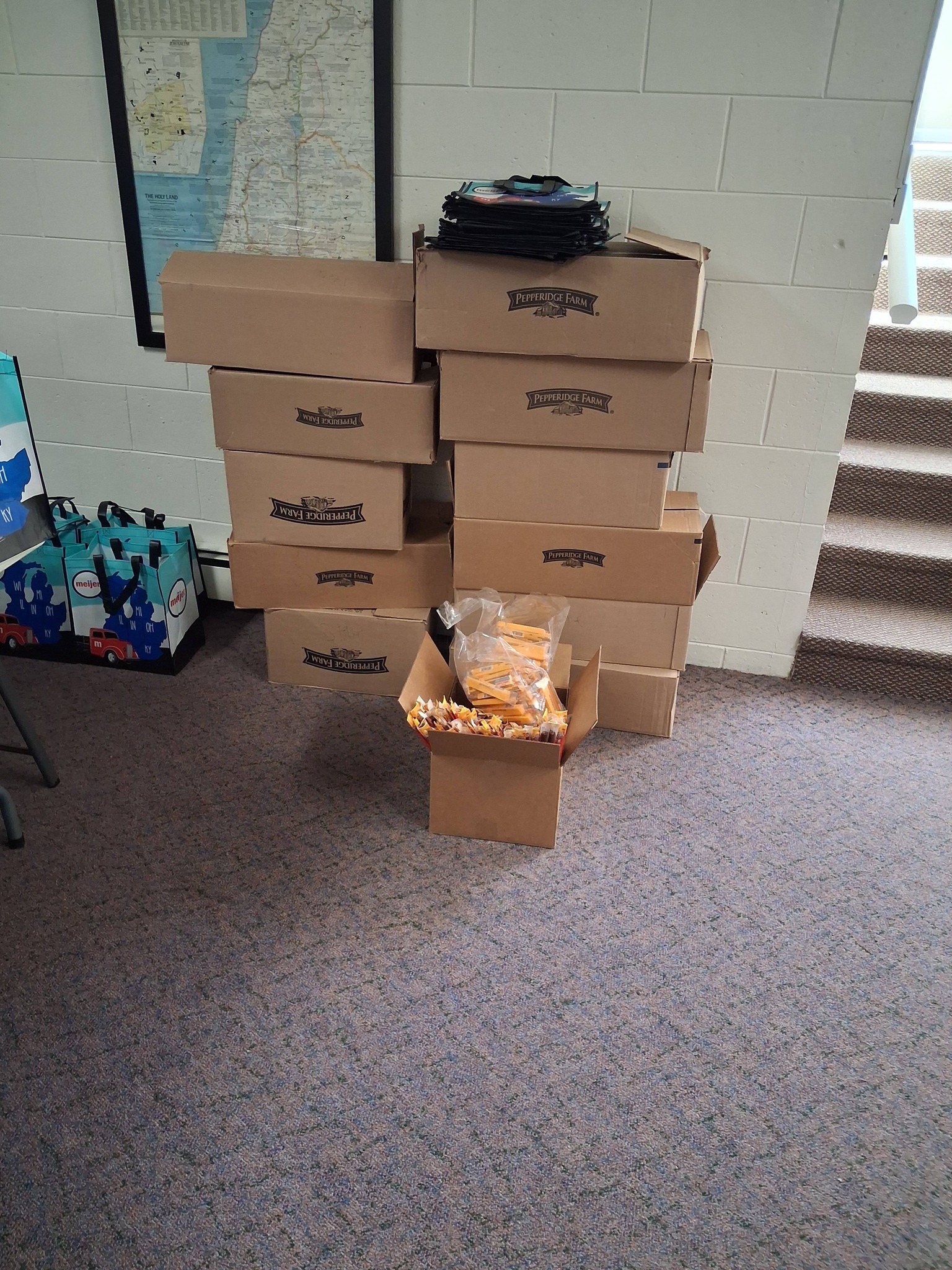 Stacks of Pepperidge Farm product boxes with packaged crackers or chips displayed in an interior space.